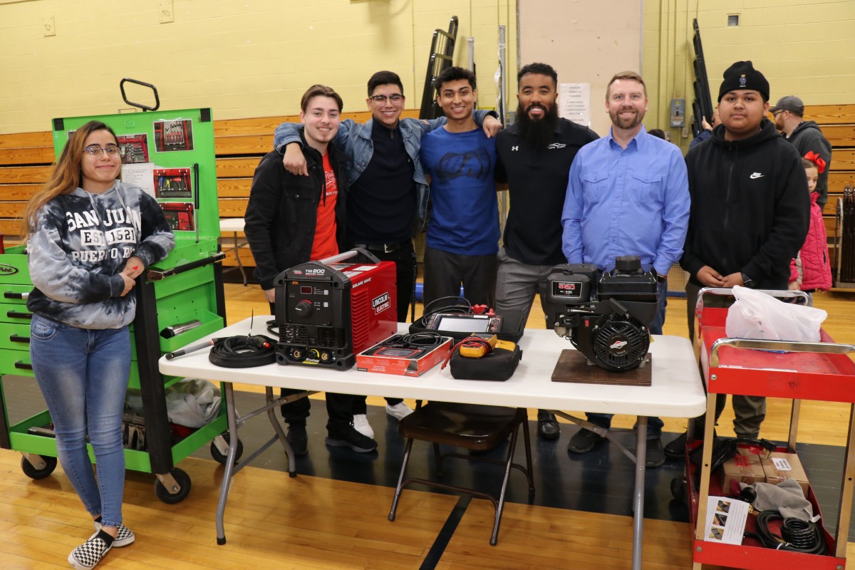 Students and teachers pose for a photo.