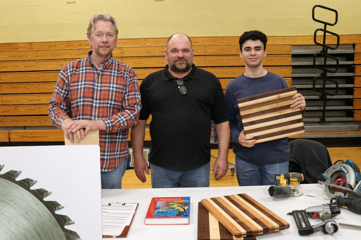 Students and teachers pose for a photo.