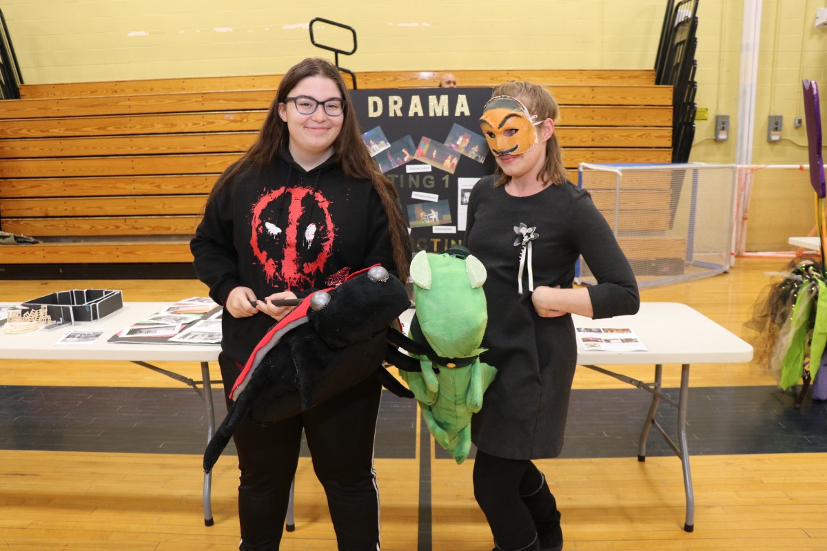 Students and teachers pose for a photo.