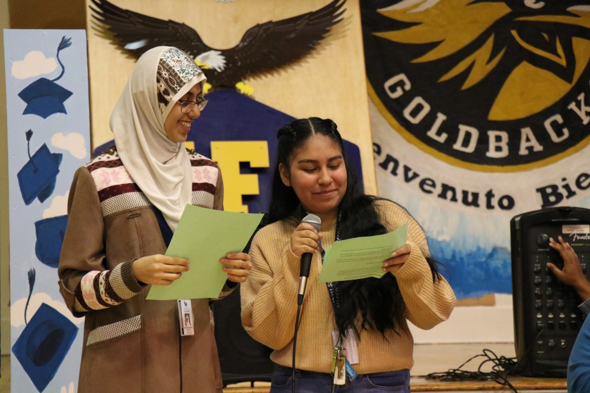 Aishah Alshaikh and Melanie Rodriguez, both 9th grade scholars at NFA West, introduce the panelists.