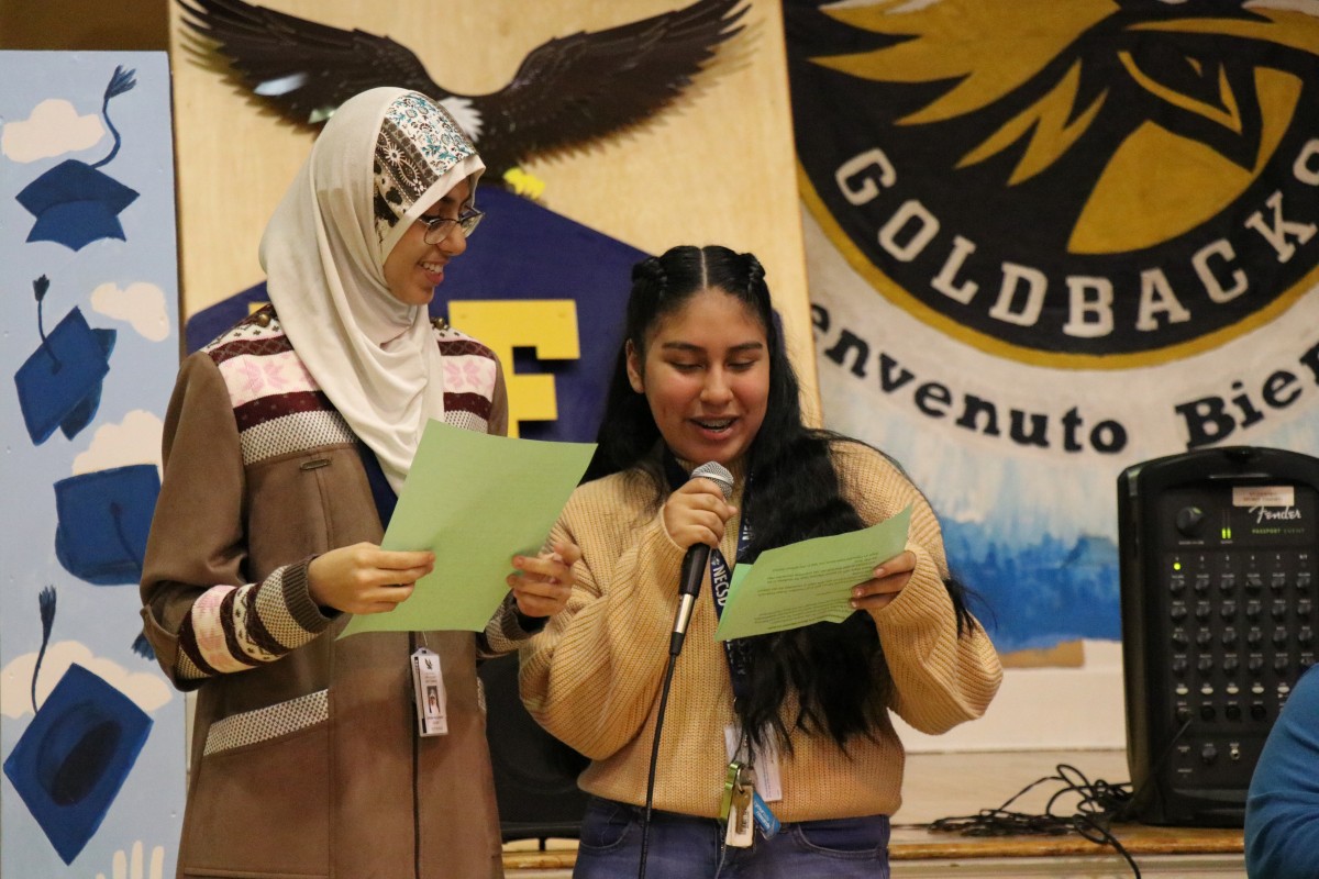 Aishah Alshaikh and Melanie Rodriguez, both 9th grade scholars at NFA West, introduce the panelists.