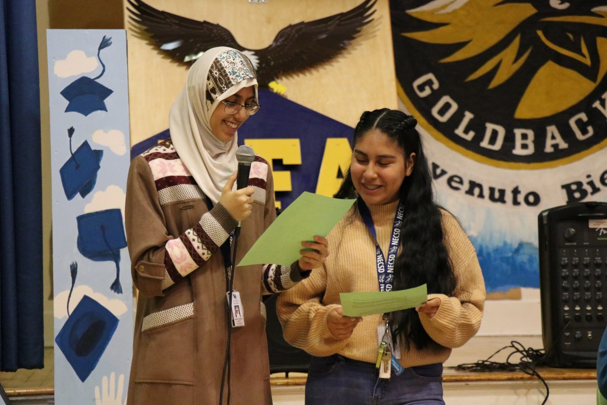 Aishah Alshaikh and Melanie Rodriguez, both 9th grade scholars at NFA West, introduce the panelists.