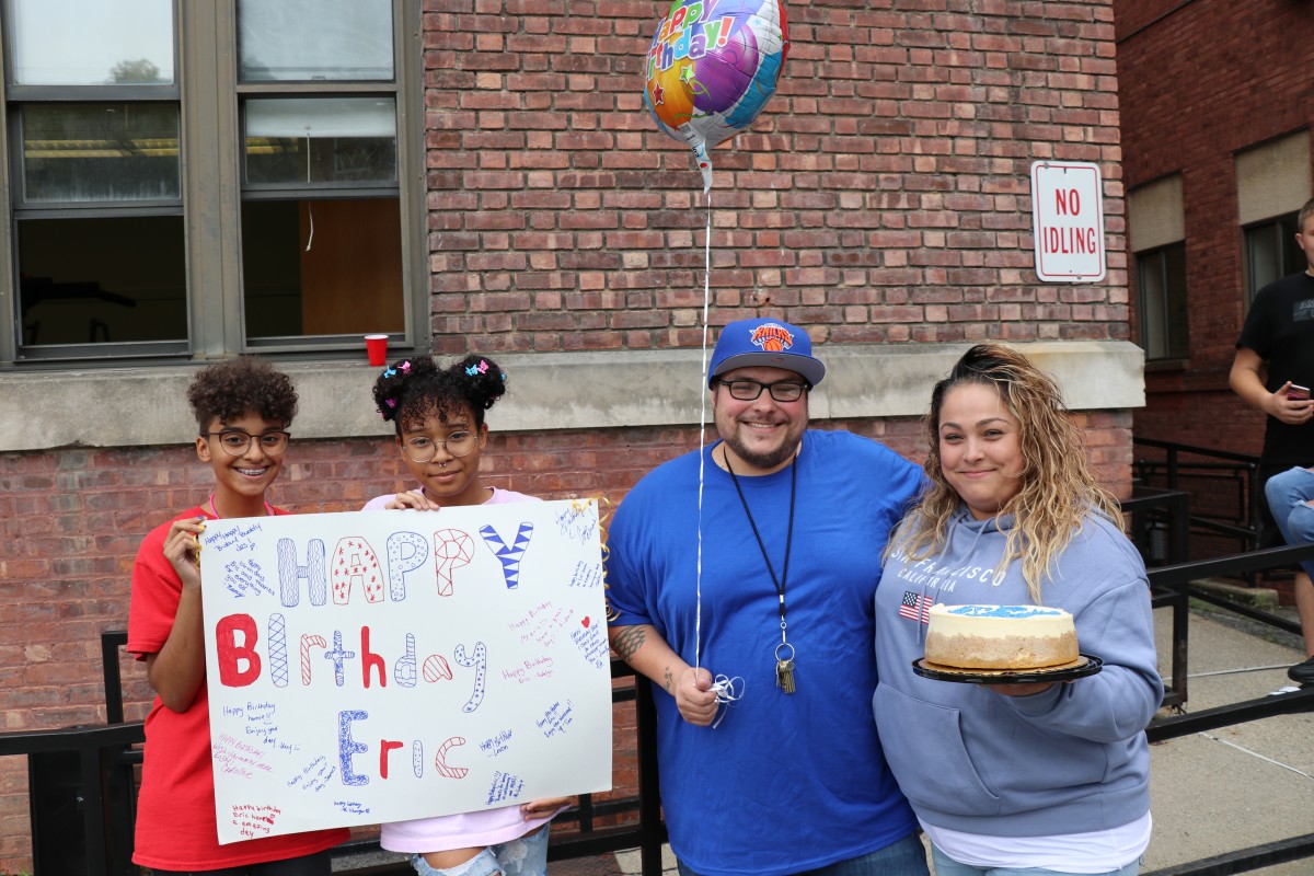 Students celebrate custodian's birthday.