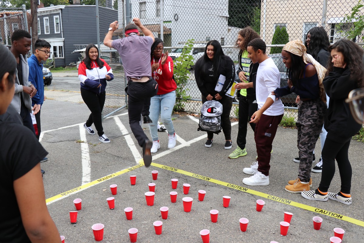 Students help teacher navigate the maze.