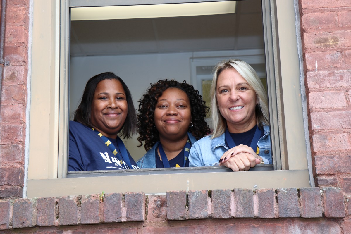 Faculty/staff pose for a photo.