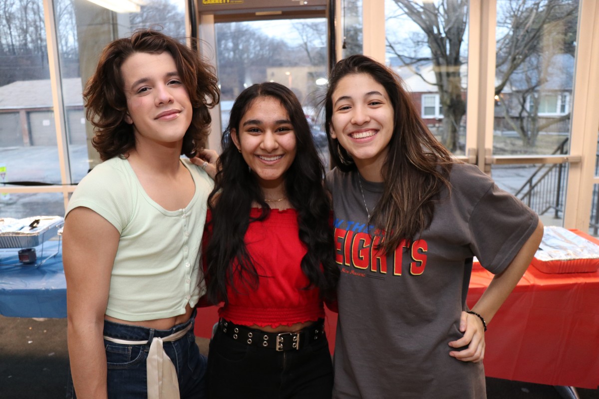 Cast and crew members of In the Heights pose for a photo