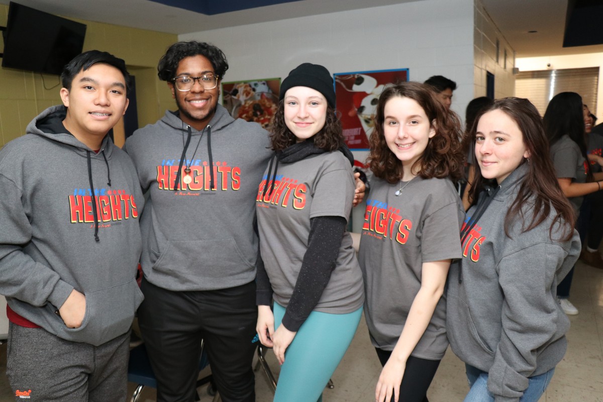 Cast and crew members of In the Heights pose for a photo