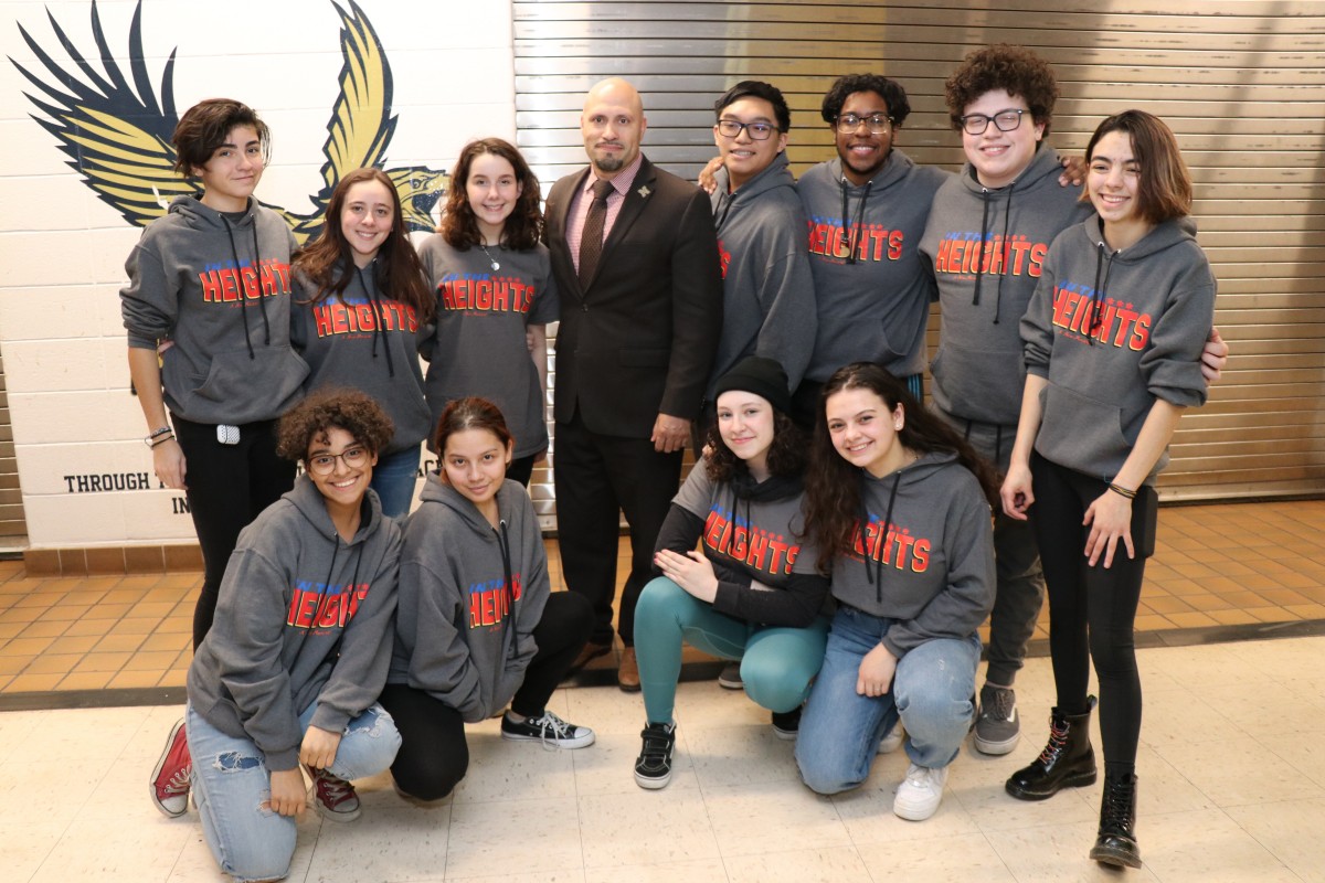 Cast and crew members of In the Heights pose for a photo with Superintendent Dr. Padilla.