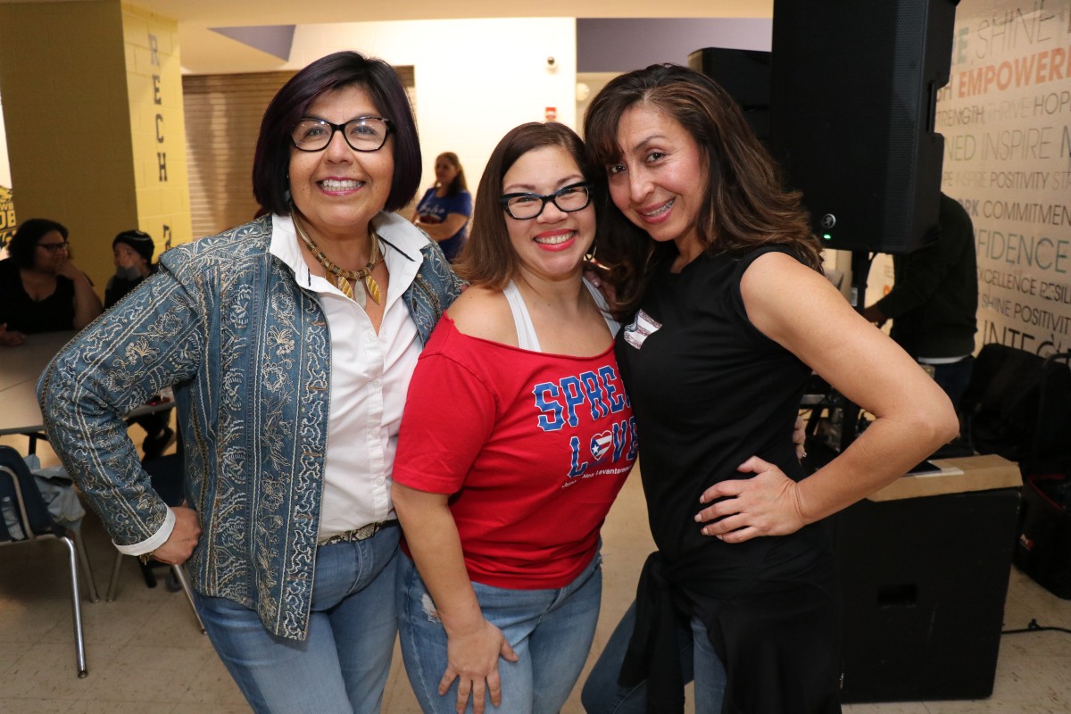 Salsa instructions, Maritza Calderon-Caballero and Kattya Fernandez pose for a photo.