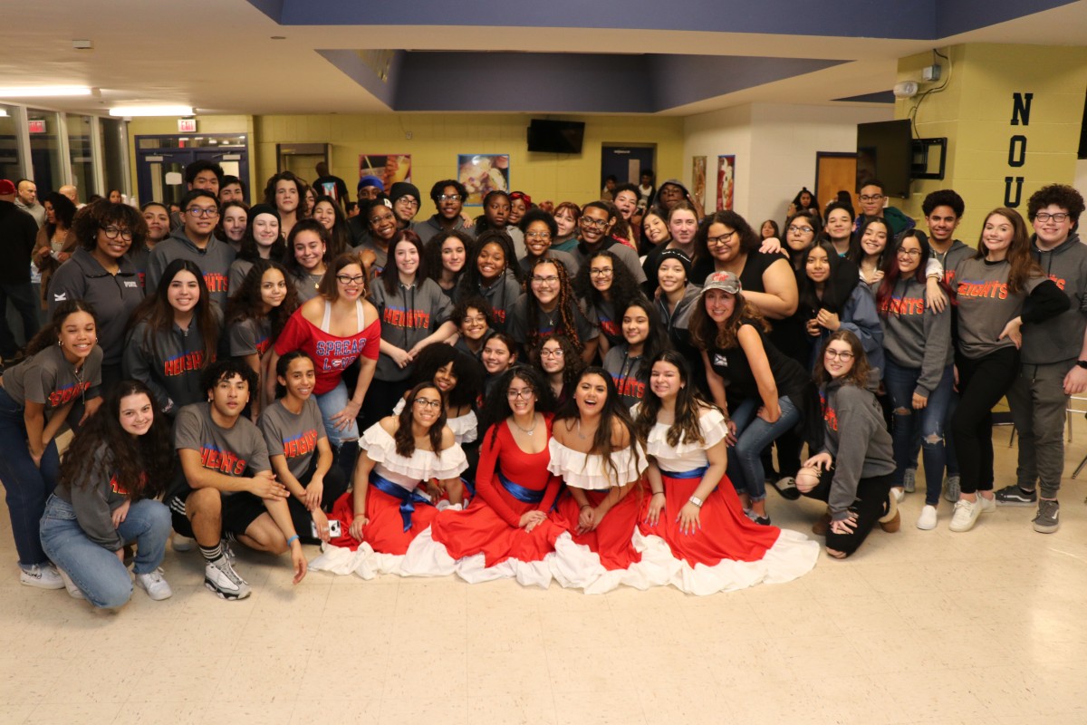 Cast and crew of In the Heights pose for a photo.