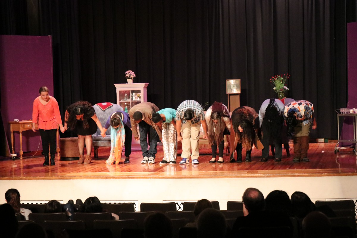 Students bow after finishing their show