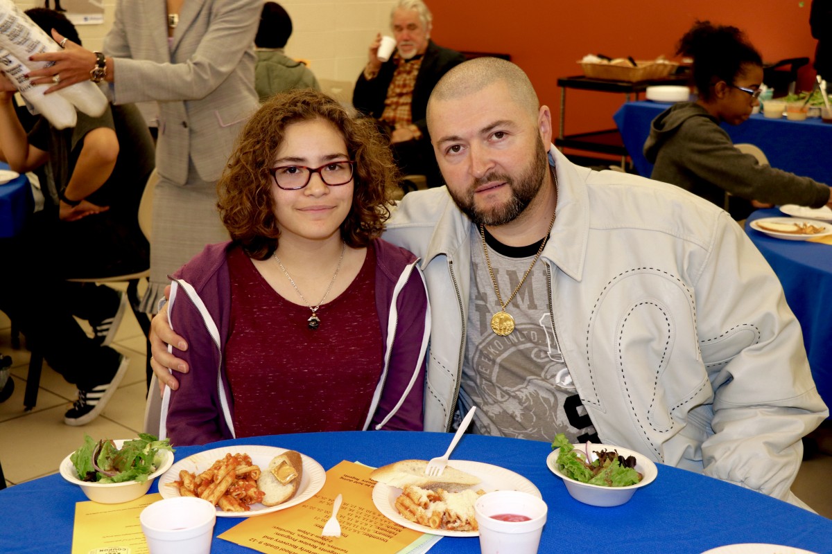 Family enjoys Pasta with the Principal