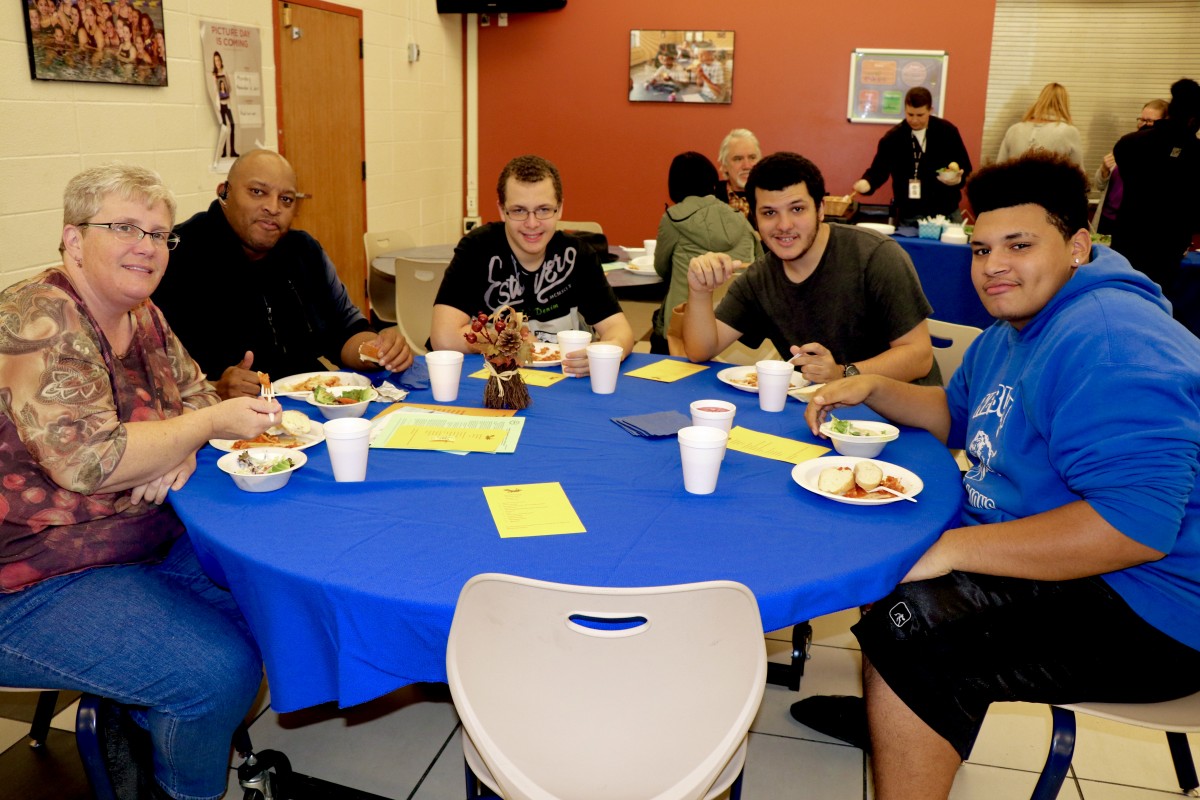 Family enjoys Pasta with the Principal