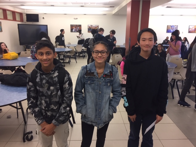 Scholars pose in a group at the event.