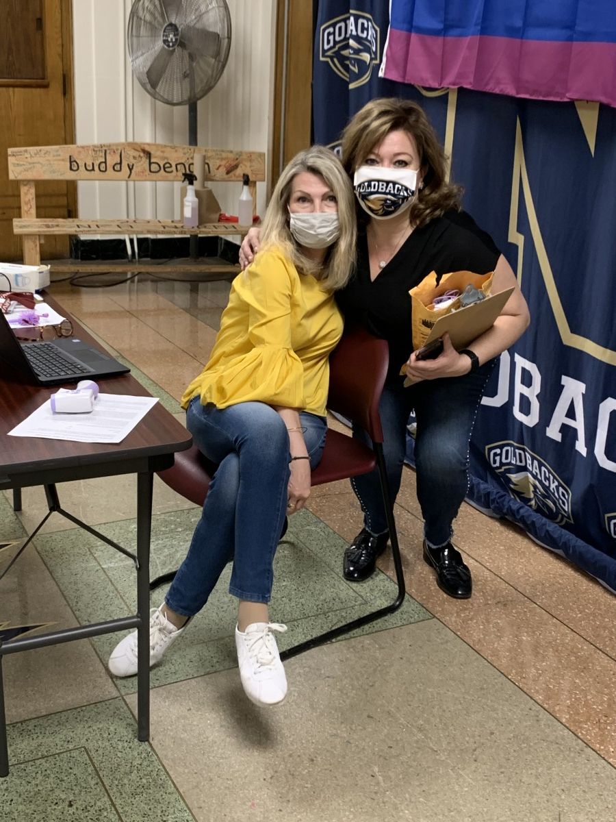 Faculty staff pose in t-shirts and masks that celebrate Black History Month.