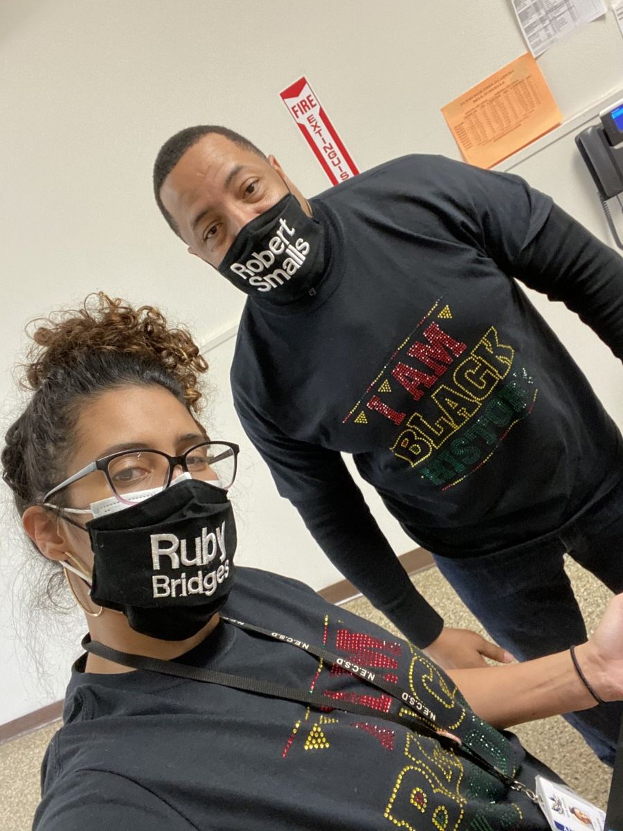 Faculty staff pose in t-shirts and masks that celebrate Black History Month.