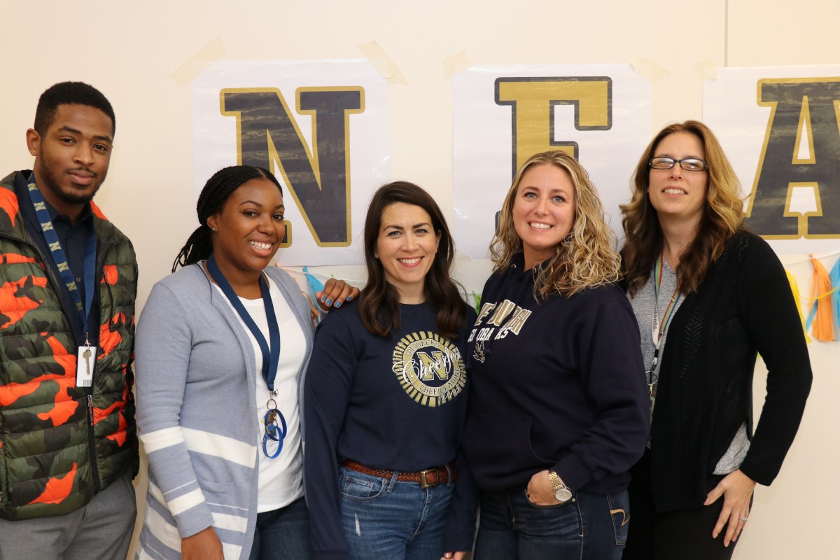 Faculty and staff pose for a photo.