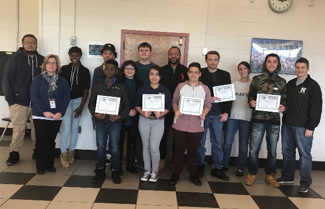 Students pose with award