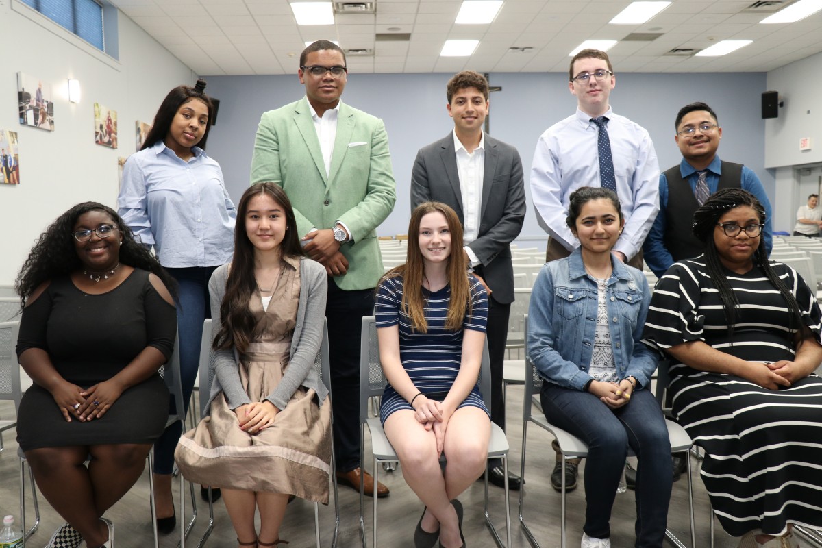 Senior speakers pose for a photo.