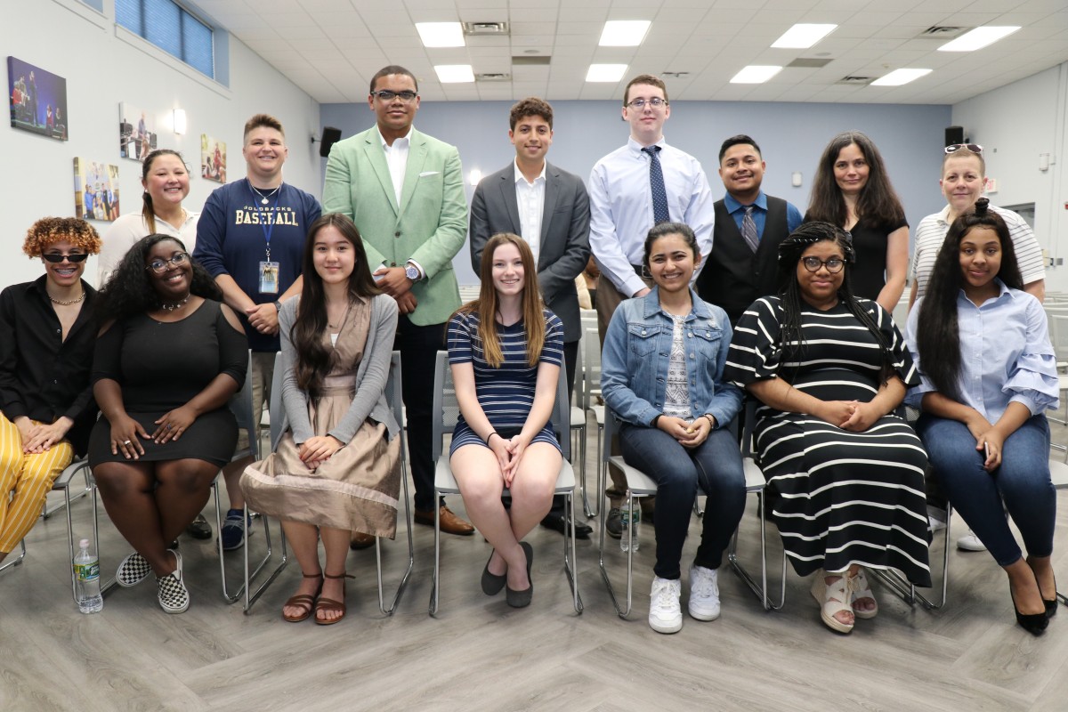 Senior speakers with teachers who supported their efforts.