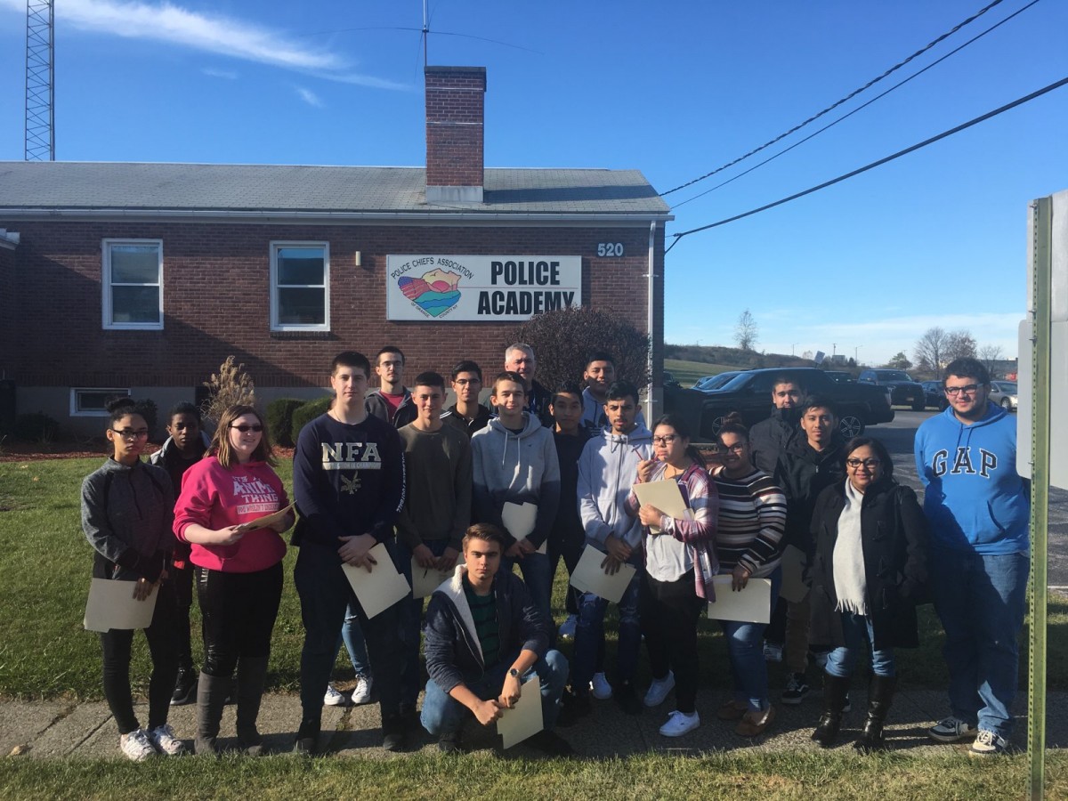 Students pose in front of the center