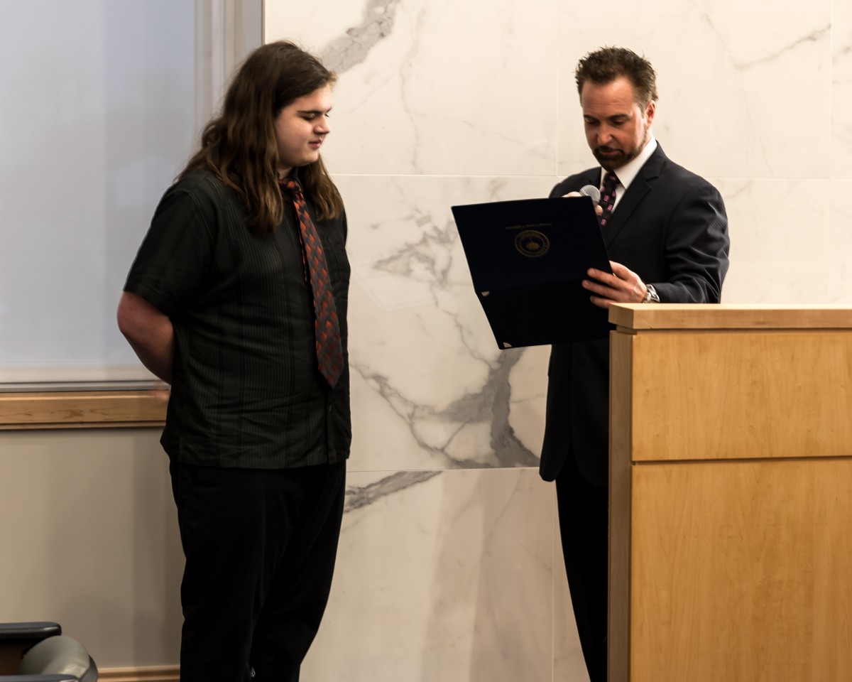 Orange County Legislator Joseph Minuta - District 15 presenting Manny with a certificate.