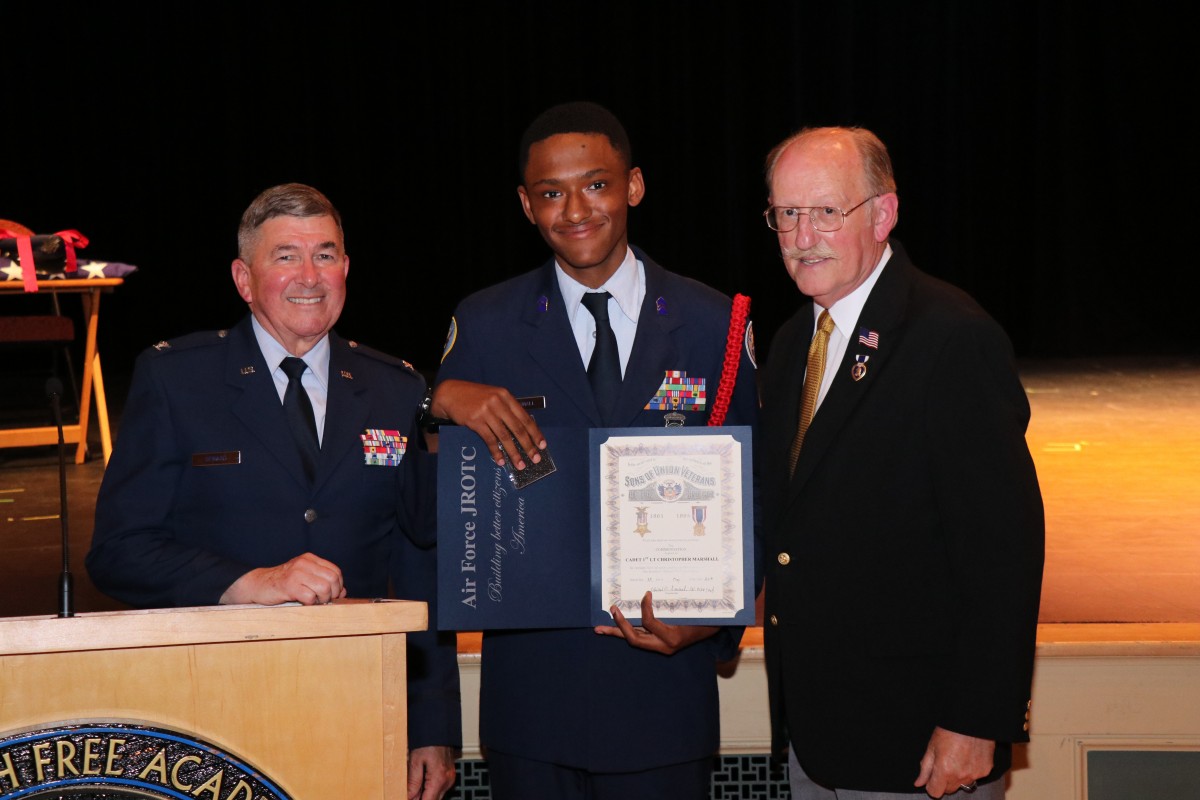 Students pose with their award.