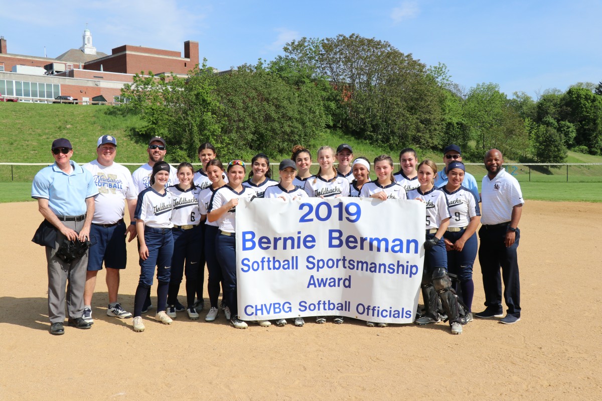 Team with award banner.