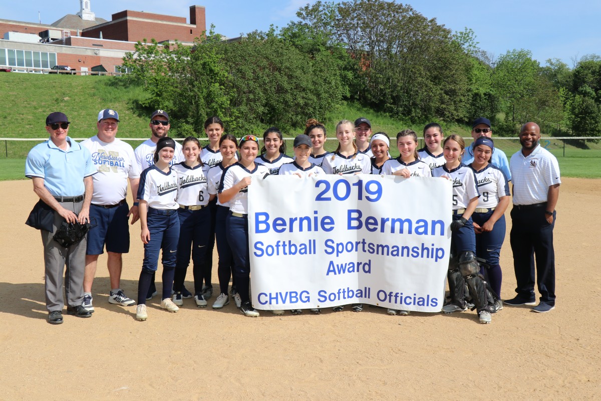 Team with award banner.