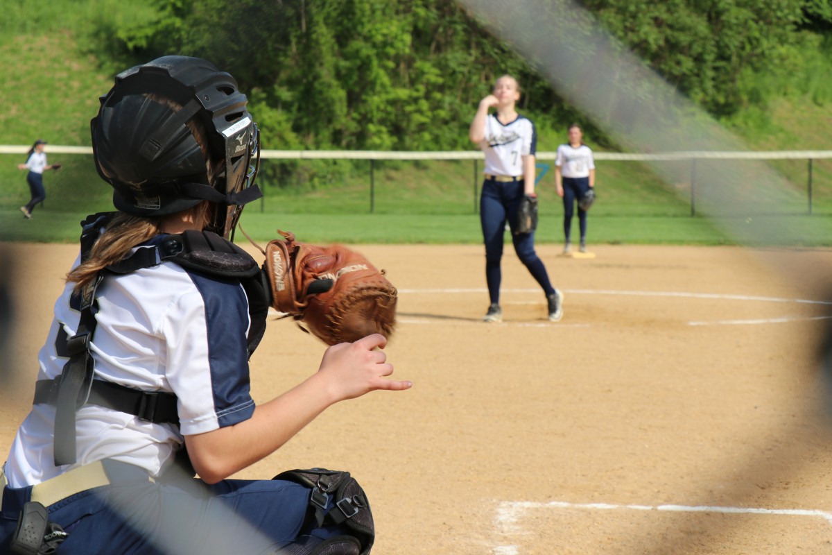 NFA player pitching ball.