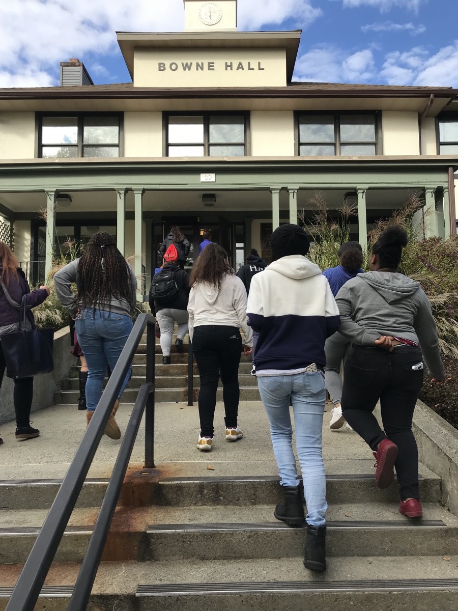 Students enter a building
