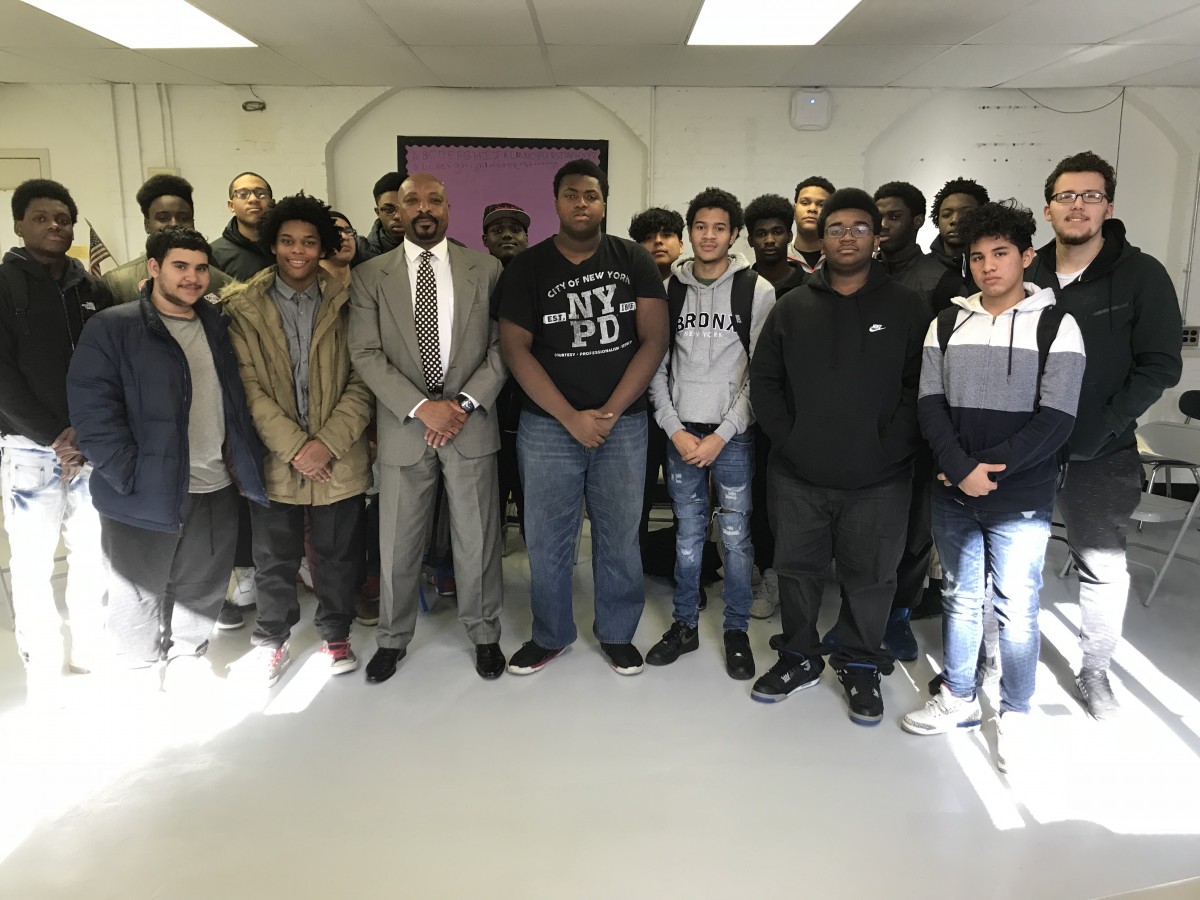 All Male Mentoring Group students pose with Mr. Newton