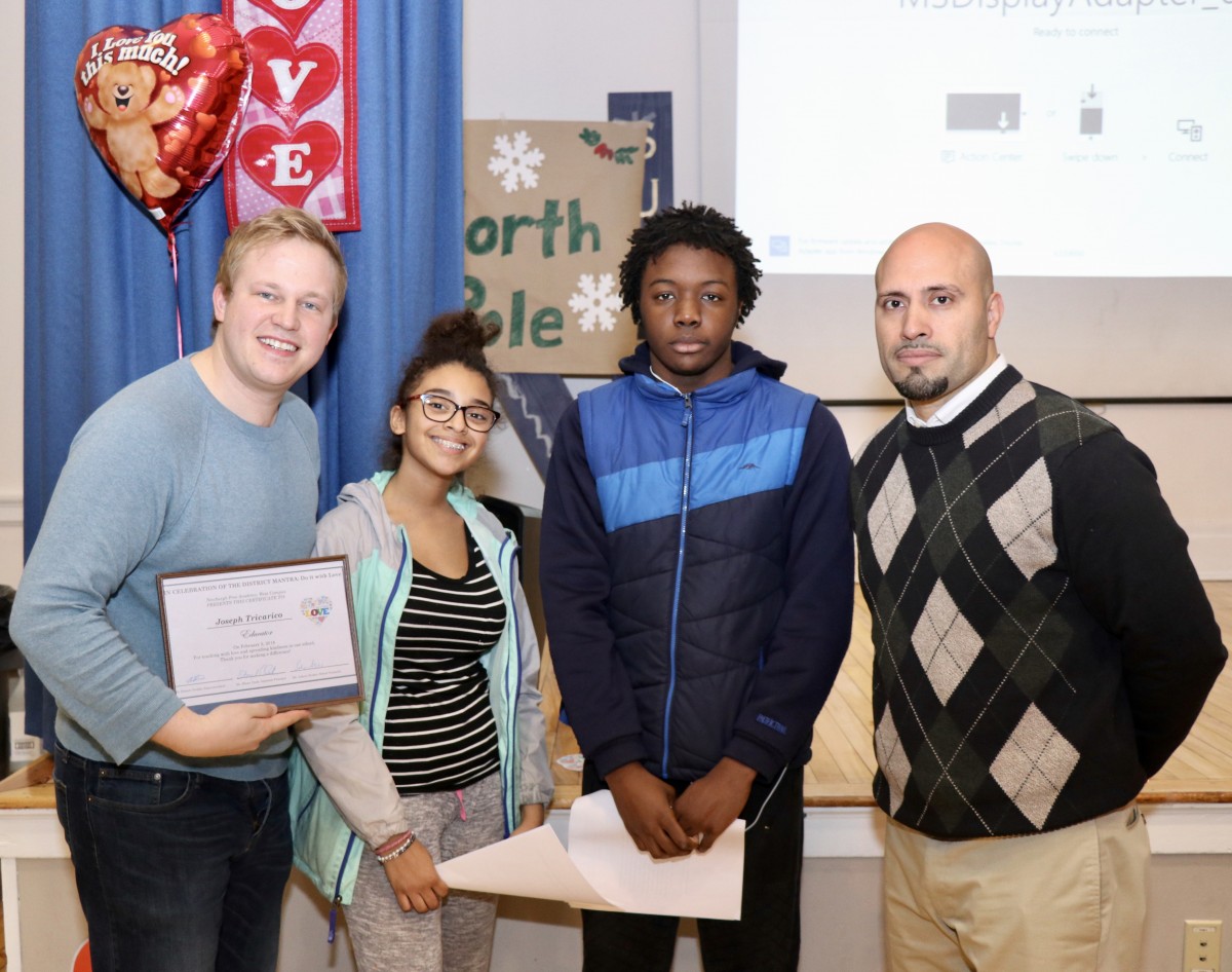 Mr. Joe standing with Student Advisory members and Dr. Padilla