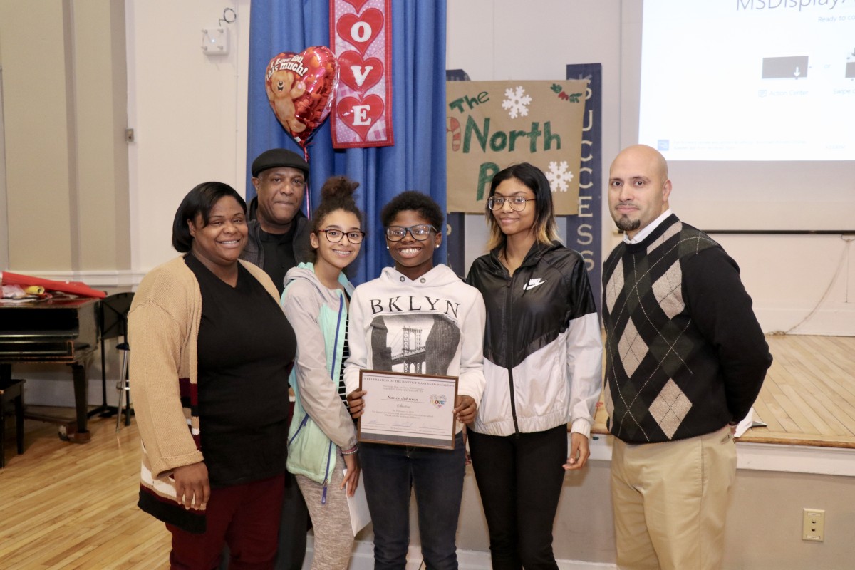 Student Advisory members standing with Dr. Padilla, Nancy, and her parents