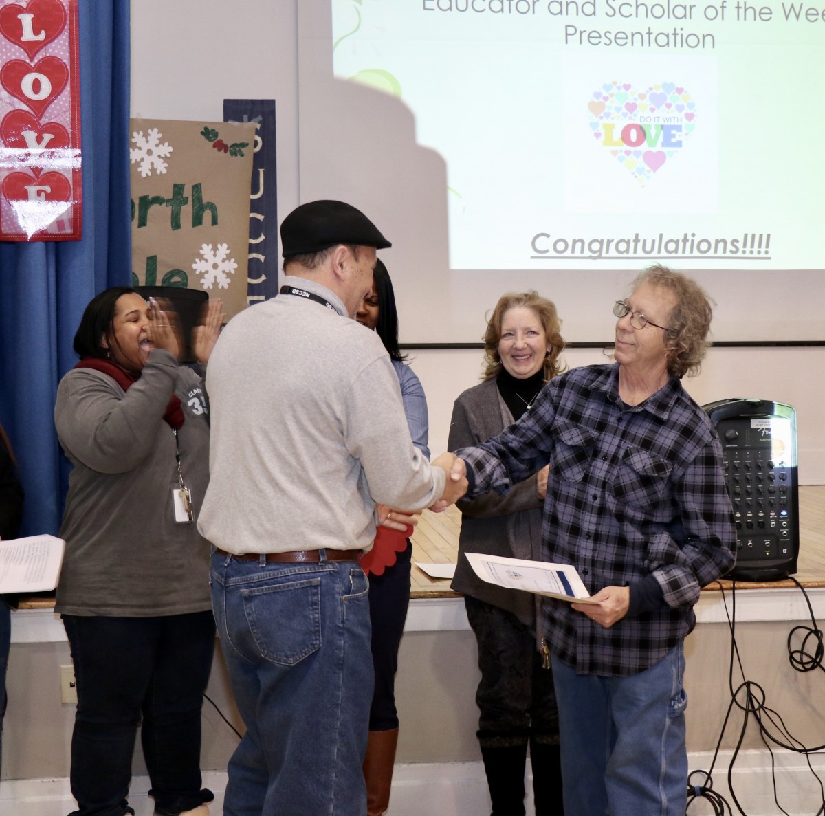 Mr. Andy Velez handing out the award to Mr. Rich