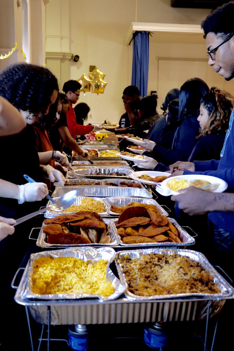 Students serve each other for International Celebration