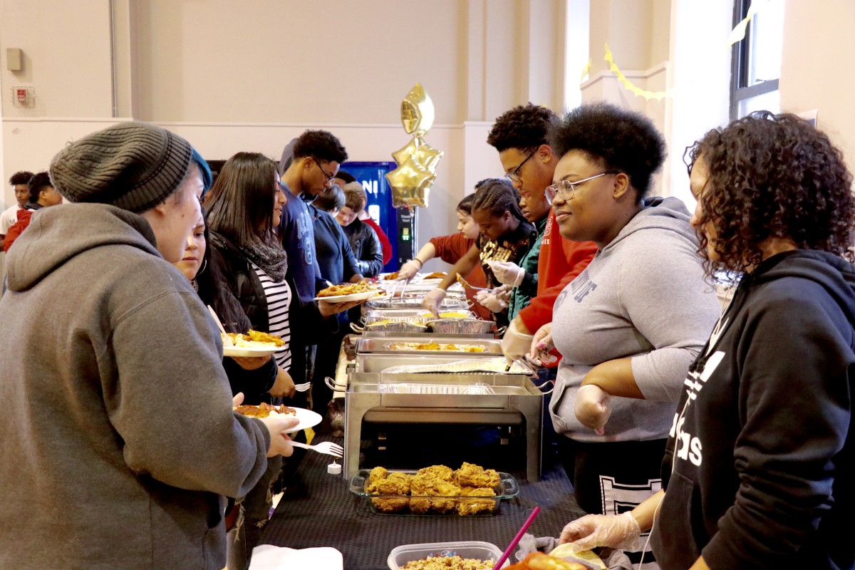 Students serve each other for International Celebration