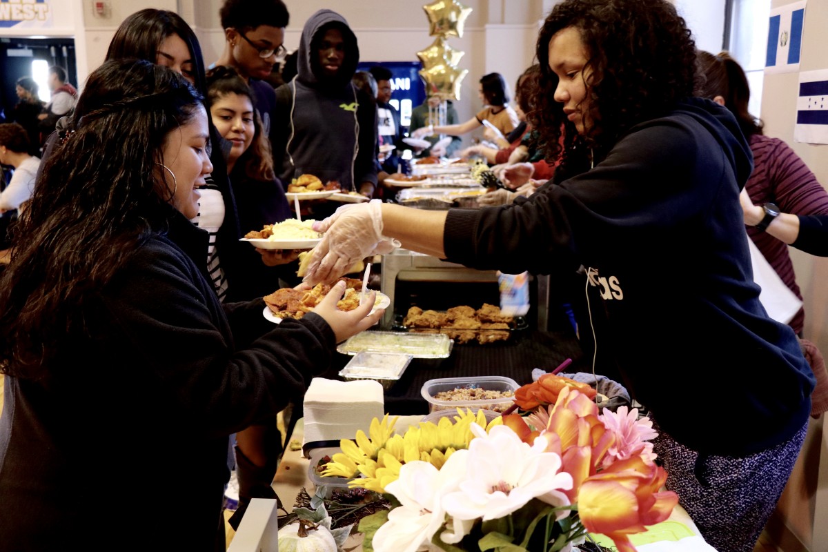 Students serve each other for International Celebration