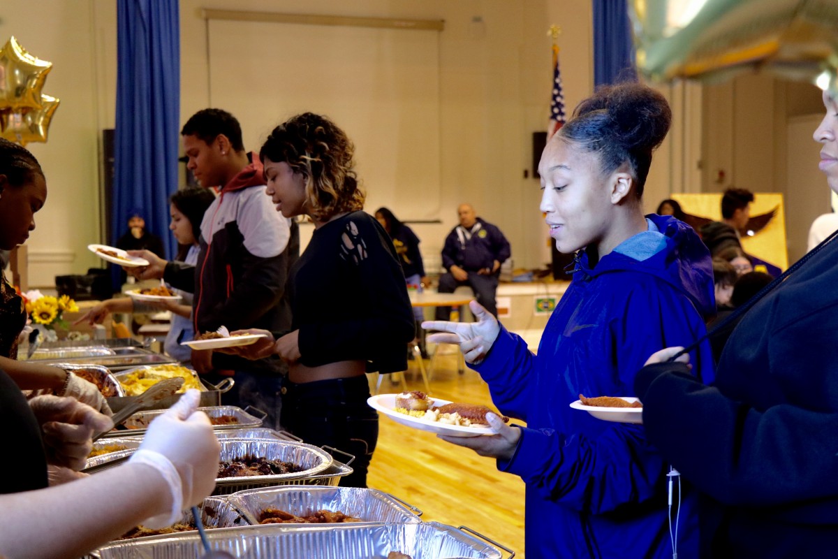 Students serve each other for International Celebration