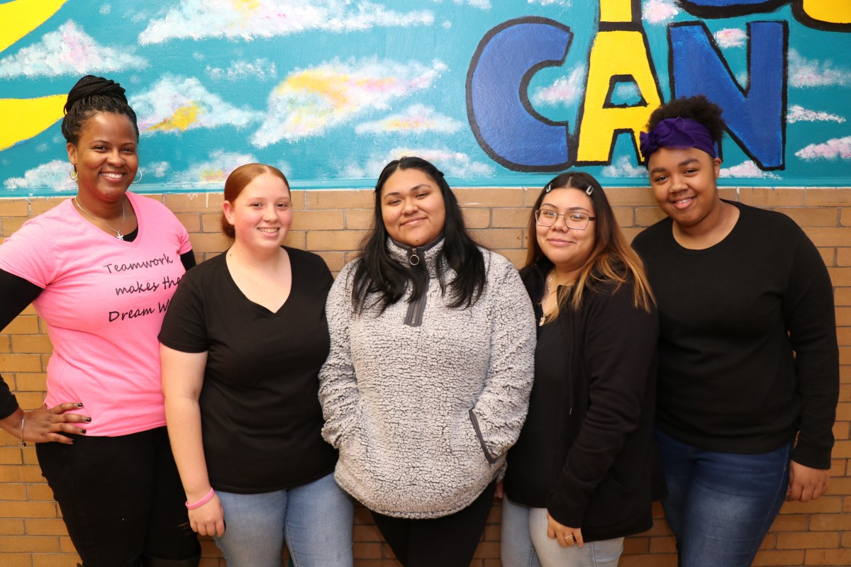 Ms. Stukes and student organizers pose for a photo.