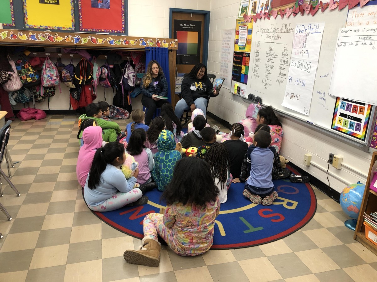 NFA West scholar reading to Meadow Hill scholars.