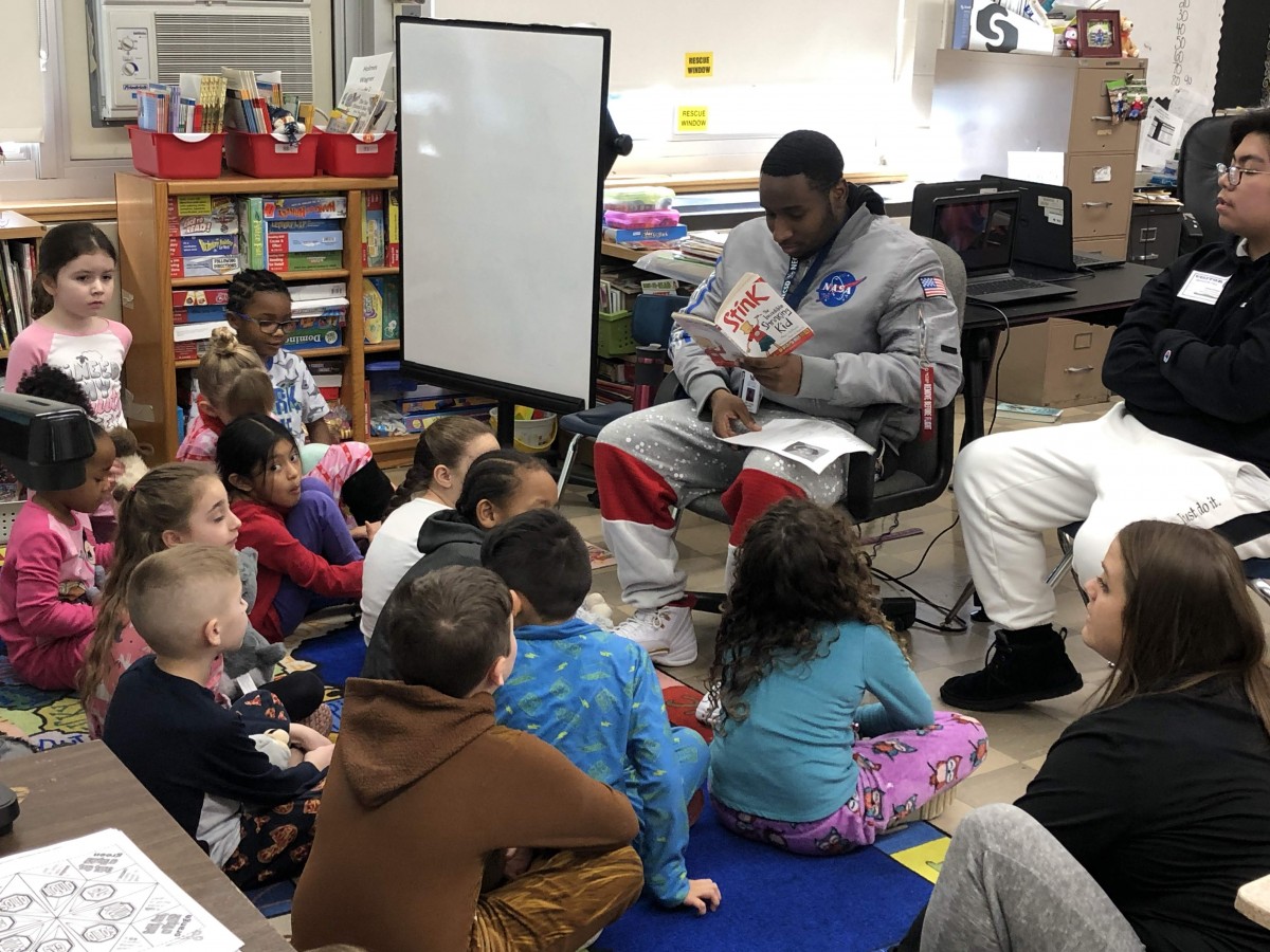 NFA West scholar reading to Meadow Hill scholars.