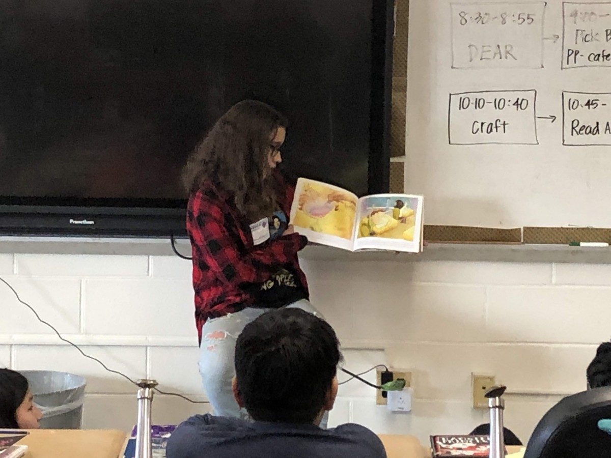 NFA West scholar reading to Meadow Hill scholars.