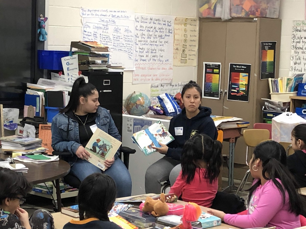 NFA West scholars reading to Meadow Hill scholars.