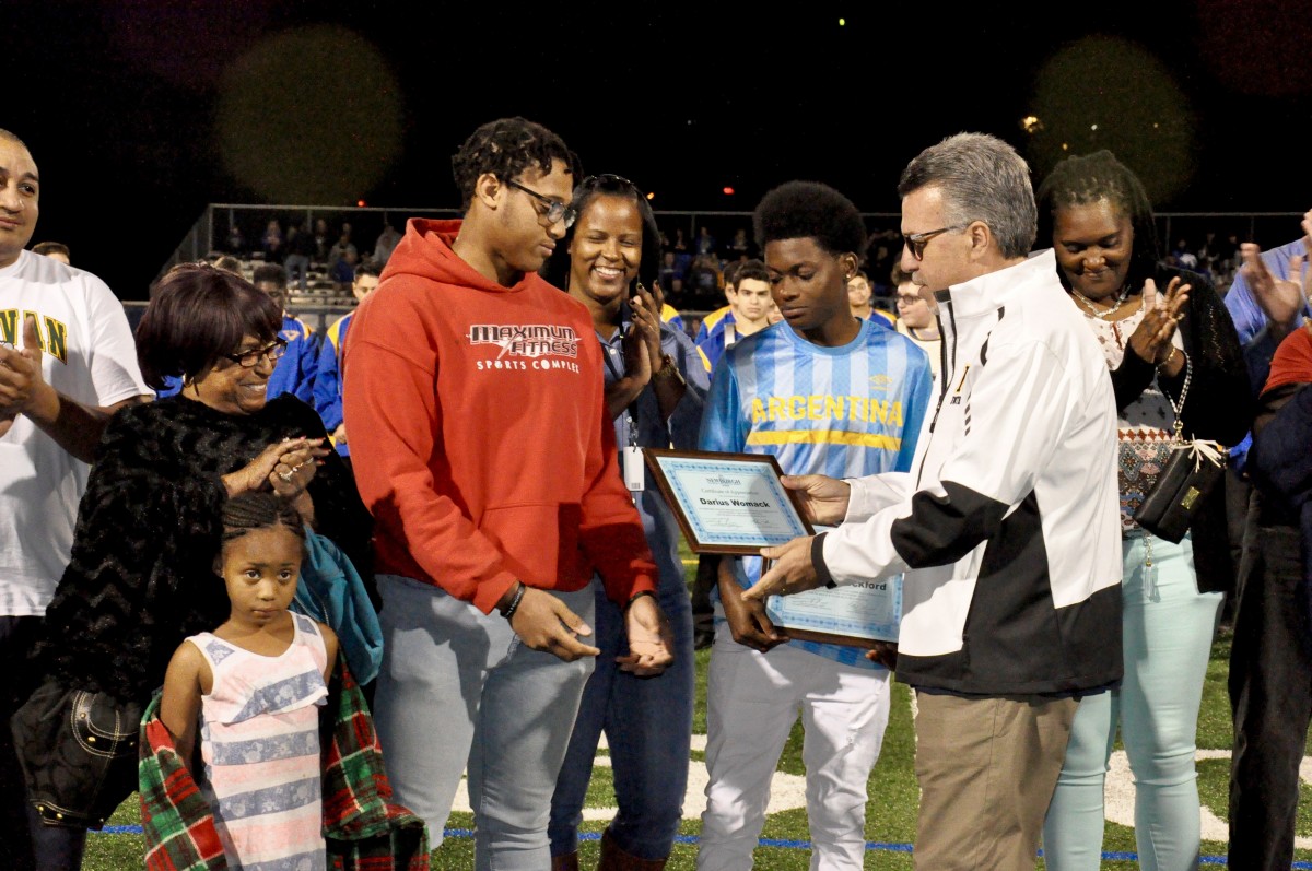 Students from NFA West accept recognition for work they do in the community