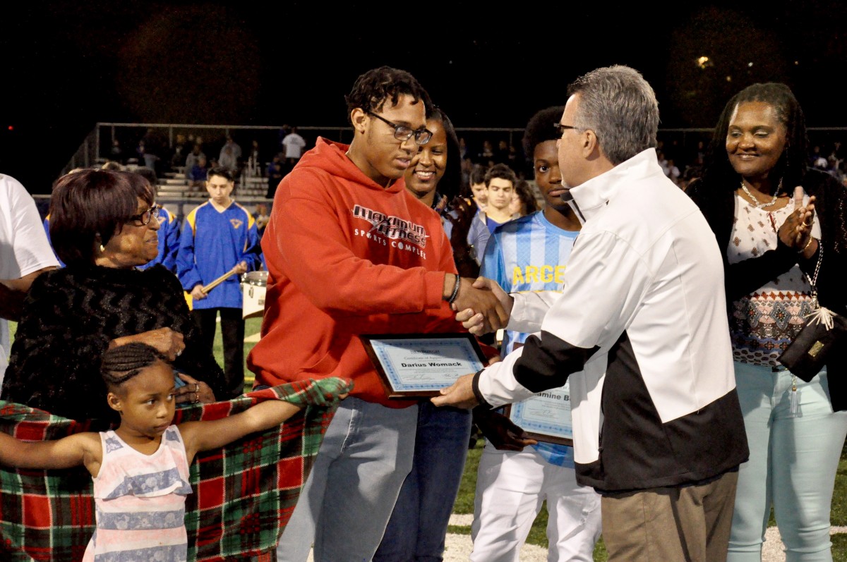 Students from NFA West accept recognition for work they do in the community