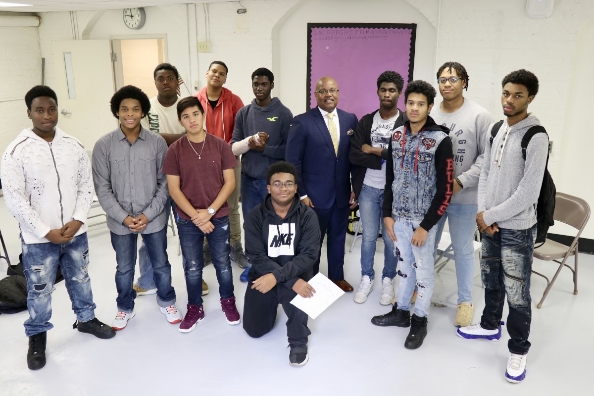 Members of NFA West’s Young Men’s Group Mentoring Program stand with Mr. Howard