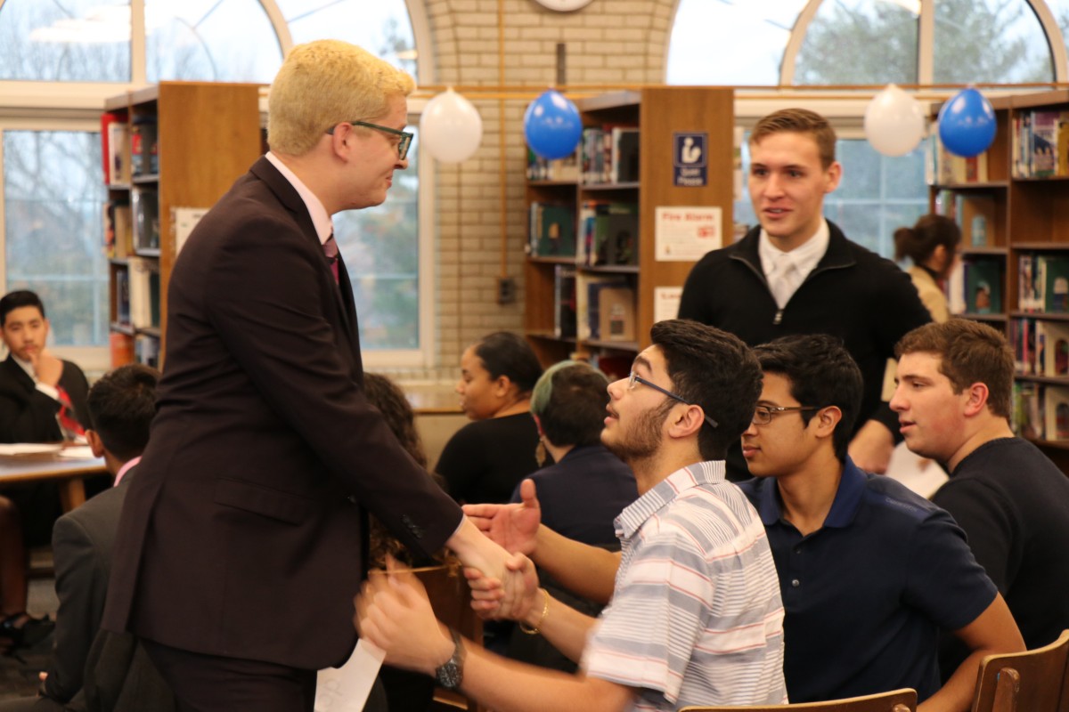 Student campaigns for votes.