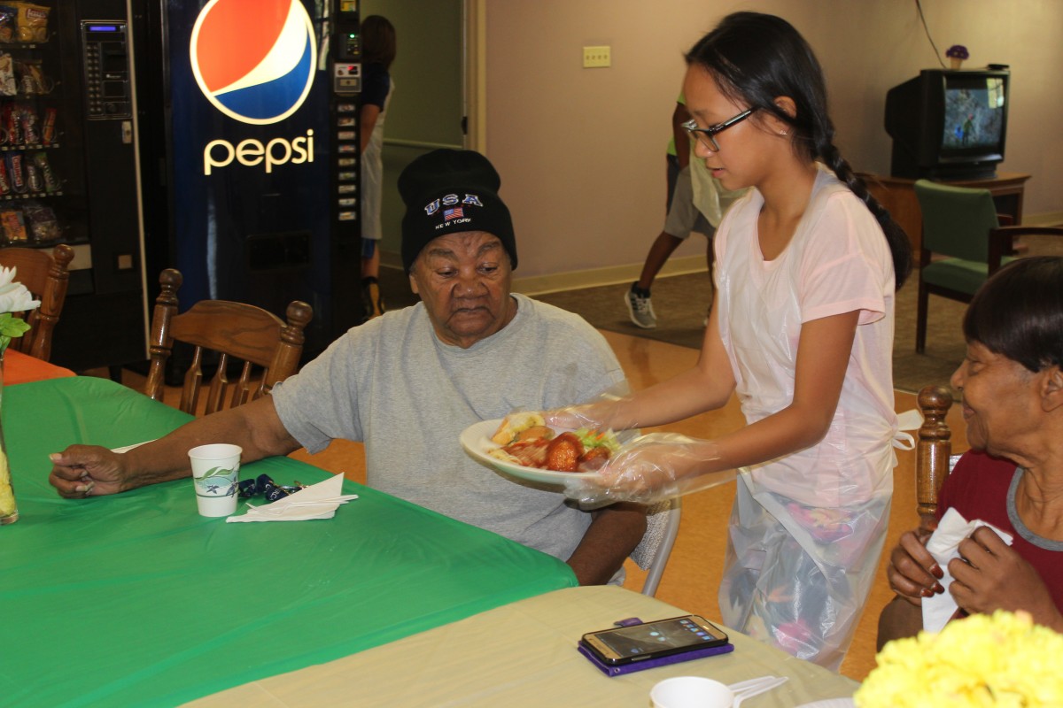 Another student serving lunch