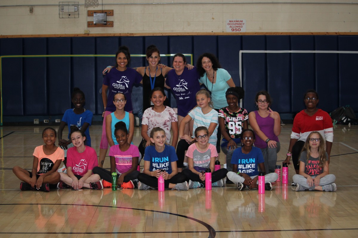 Group photo of girls in the gym.